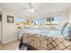 Bedroom featuring two large windows providing ample natural light, and terrazzo flooring at 8467 8Th N Way, St Petersburg, FL 33702