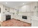 Bright kitchen with white cabinetry, modern appliances, and terracotta tile flooring at 8467 8Th N Way, St Petersburg, FL 33702