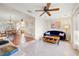 Inviting living room showcasing adjacent dining room, ceiling fan, and cozy seating at 8467 8Th N Way, St Petersburg, FL 33702