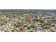 Wide aerial shot of a quiet neighborhood with well-maintained houses and mature trees plus waterfront at 930 40Th Ne Ave, St Petersburg, FL 33703