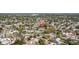 Aerial view showcases neighborhood with mature trees and light blue home marked with location pin at 930 40Th Ne Ave, St Petersburg, FL 33703