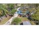 Aerial view of the property showing the light blue home, fenced yard, and neighborhood at 930 40Th Ne Ave, St Petersburg, FL 33703