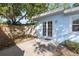 Cozy back patio featuring double French doors and light blue exterior, perfect for relaxing or entertaining at 930 40Th Ne Ave, St Petersburg, FL 33703