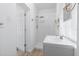 Clean, all-white bathroom with a shower and sink at 930 40Th Ne Ave, St Petersburg, FL 33703