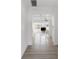 Hallway showing open layout connecting the living room and kitchen with modern flooring at 930 40Th Ne Ave, St Petersburg, FL 33703
