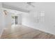 Bright and airy living room with a ceiling fan, neutral paint and light wood floors at 930 40Th Ne Ave, St Petersburg, FL 33703