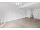 Bright living room features neutral walls, light wood floors, and a contemporary ceiling fan at 930 40Th Ne Ave, St Petersburg, FL 33703