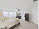 Main bedroom featuring a large bed, carpet floors, and natural light at 943 Terra Vista St, Brandon, FL 33511