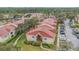 Overhead view of a condo complex with tidy landscaping, parking, and community layout at 9481 Highland Oak Dr # 706, Tampa, FL 33647