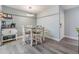 Dining area features a modern light fixture, gray walls, white trim, and a breakfast nook at 9481 Highland Oak Dr # 706, Tampa, FL 33647