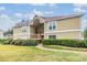Exterior view of a two-story condo building with well-maintained landscaping at 9481 Highland Oak Dr # 706, Tampa, FL 33647