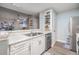 Well-equipped kitchen showcasing white cabinets, granite counters, and stainless steel appliances at 9481 Highland Oak Dr # 706, Tampa, FL 33647