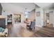 Open-concept living room featuring a large window, hardwood floors, and a ceiling fan at 9481 Highland Oak Dr # 706, Tampa, FL 33647