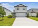 Charming two-story home features a well-manicured lawn and a spacious two-car garage at 10537 Hidden Banks Gln, Parrish, FL 34219