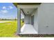 Covered patio, overlooking a lush green lawn and tranquil lake at 10537 Hidden Banks Gln, Parrish, FL 34219