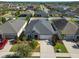 Aerial view of a cozy neighborhood with meticulously maintained landscaping and backyard spaces at 13123 Rain Lily Dr, Riverview, FL 33579