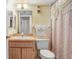 Standard bathroom with a neutral color palette, single sink, and combination shower and tub at 1420 Oak Hill Dr # 102, Dunedin, FL 34698