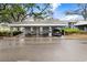 Carport with covered parking spaces, enhancing the convenience for residents and guests at 1420 Oak Hill Dr # 102, Dunedin, FL 34698