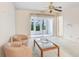 Relaxing living room with comfortable seating and a sliding glass door leading to outdoor views at 1420 Oak Hill Dr # 102, Dunedin, FL 34698