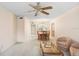 Open-concept living space offers comfortable seating and flows into the dining area for easy entertaining at 1420 Oak Hill Dr # 102, Dunedin, FL 34698