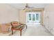 Cozy living room with a sliding glass door, offering plenty of natural light at 1420 Oak Hill Dr # 102, Dunedin, FL 34698