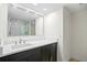 Modern bathroom with a sleek vanity, large mirror, and glass-enclosed shower at 1430 Gulf Blvd # 603, Clearwater Beach, FL 33767