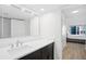 Clean bathroom featuring a vanity with a large mirror, and a doorway view to the bedroom at 1430 Gulf Blvd # 603, Clearwater Beach, FL 33767