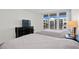 Comfortable bedroom with two beds, a dresser with a TV, and a relaxing atmosphere at 1430 Gulf Blvd # 603, Clearwater Beach, FL 33767