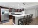 Stylish open kitchen with modern appliances and countertop seating is ideal for casual dining at 1430 Gulf Blvd # 603, Clearwater Beach, FL 33767
