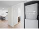 Convenient in-unit laundry area with stacked washer and dryer, located off the kitchen at 1430 Gulf Blvd # 603, Clearwater Beach, FL 33767