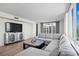 Spacious living room with large windows offering lots of natural light and neutral decor at 1430 Gulf Blvd # 603, Clearwater Beach, FL 33767