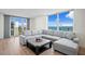 Bright living room featuring water views, a comfortable sectional sofa, and modern accents at 1430 Gulf Blvd # 603, Clearwater Beach, FL 33767