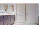 Bathroom featuring a modern vanity, decorative mirrors, and neutral color scheme at 146 4Th Ne Ave # 204, St Petersburg, FL 33701