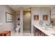 Stylish bathroom with a glass-enclosed shower, dual vanity, and elegant fixtures at 146 4Th Ne Ave # 204, St Petersburg, FL 33701
