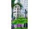 Apartment building exterior with palm tree and sign for ice cream at 146 4Th Ne Ave # 204, St Petersburg, FL 33701