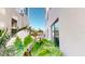 View of exterior of the building showing modern architecture and lush landscaping at 146 4Th Ne Ave # 204, St Petersburg, FL 33701