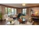 Elegant living room with a piano, neutral furniture, dark wood floors, and lots of natural light at 146 4Th Ne Ave # 204, St Petersburg, FL 33701
