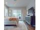 Serene main bedroom with balcony access, neutral tones, and stylish furnishings for a relaxing retreat at 146 4Th Ne Ave # 204, St Petersburg, FL 33701