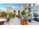 Expansive outdoor patio featuring potted plants, string lights, and ample seating areas for relaxation at 146 4Th Ne Ave # 204, St Petersburg, FL 33701