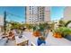 Spacious outdoor patio with comfortable seating surrounded by lush greenery at 146 4Th Ne Ave # 204, St Petersburg, FL 33701