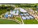 An aerial view shows community amenities including a pool, tennis courts, and clubhouse at 16683 Shell Bay Dr, Land O Lakes, FL 34638