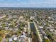 Elevated shot of a neighborhood with a home adjacent to a long, narrow body of water at 1753 25Th N Ave, St Petersburg, FL 33713