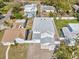 Overhead view of a two-story home with fenced yard and new gray shingle roof at 1753 25Th N Ave, St Petersburg, FL 33713