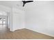 Clean and bright bedroom featuring wood grain flooring and a closet at 1753 25Th N Ave, St Petersburg, FL 33713