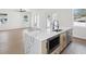Bright, open-concept kitchen with a large island, modern appliances, and a view to the adjacent living area at 1753 25Th N Ave, St Petersburg, FL 33713