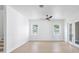 Well-lit room with fan, light wood floors and two windows at 1753 25Th N Ave, St Petersburg, FL 33713