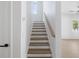 Hallway staircase with view into living room at 1753 25Th N Ave, St Petersburg, FL 33713