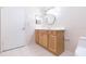 Bathroom featuring a wood vanity with stylish mirror at 1816 N Pebble Beach Blvd, Sun City Center, FL 33573