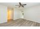 Bedroom featuring updated floor and ceiling fan with views to other rooms at 1816 N Pebble Beach Blvd, Sun City Center, FL 33573
