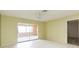 Bedroom with a large sliding glass door offering plenty of light, tiled floors at 1816 N Pebble Beach Blvd, Sun City Center, FL 33573